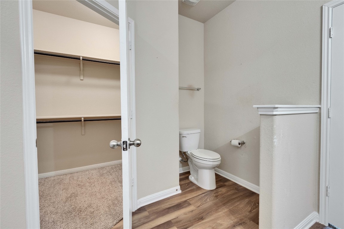 1701 Logan Drive, Unit 12 Round Rock, TX 78664 - Photo 16 of 26 a bathroom with a toilet