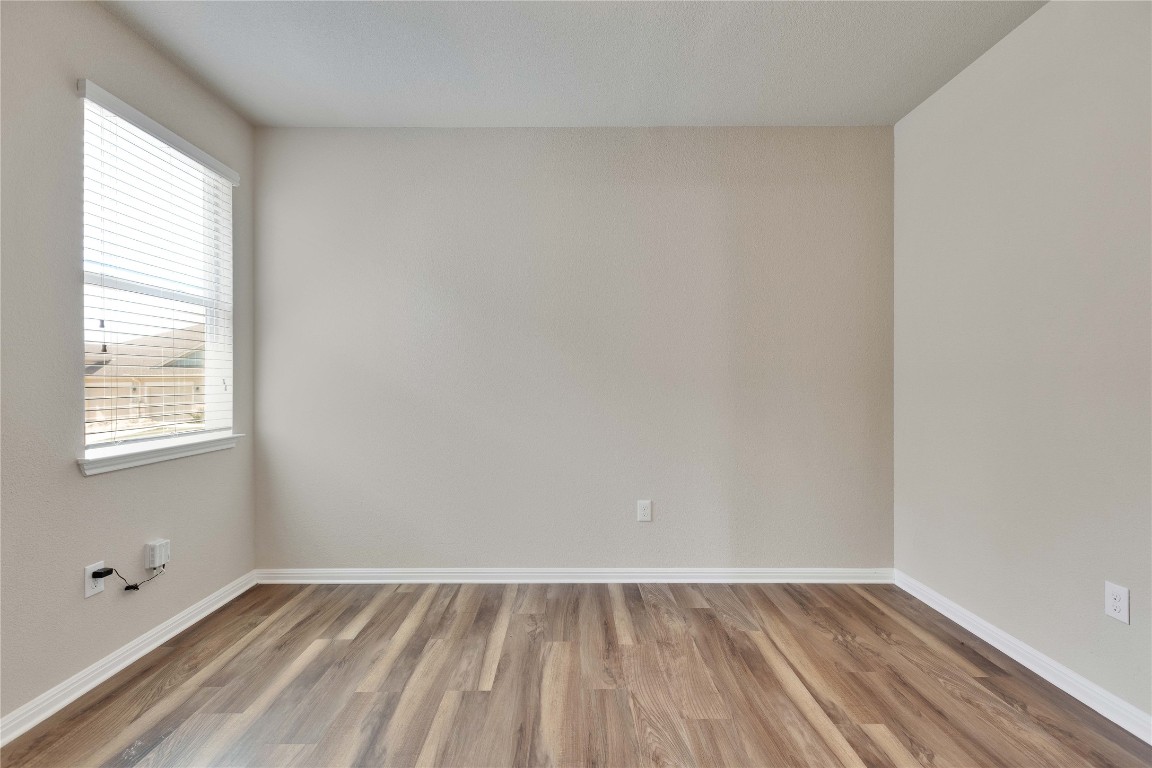1701 Logan Drive, Unit 12 Round Rock, TX 78664 - Photo 18 of 26 a view of an empty room and window