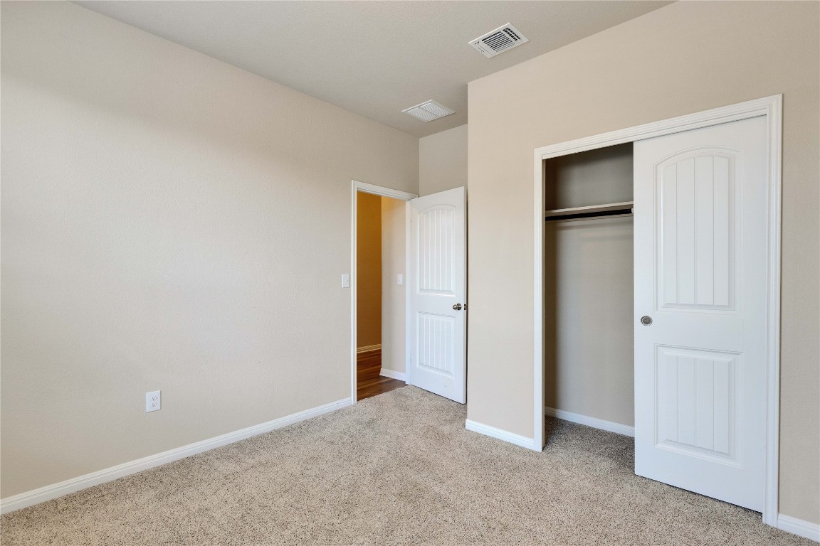 1701 Logan Drive, Unit 12 Round Rock, TX 78664 - Photo 22 of 26 a view of an empty room and closet area