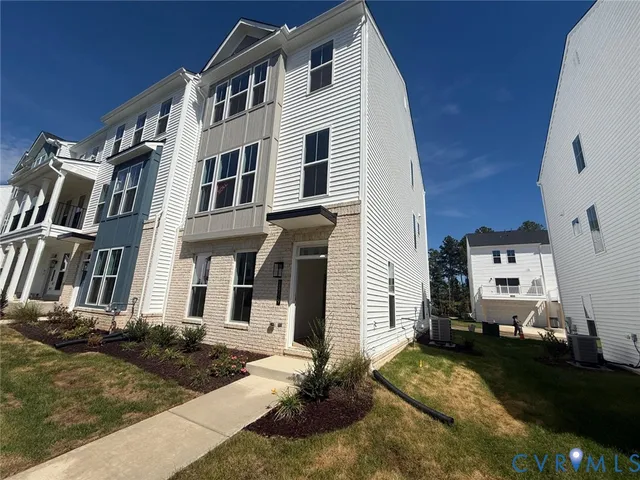 a view of a chandelier fan and wooden floor