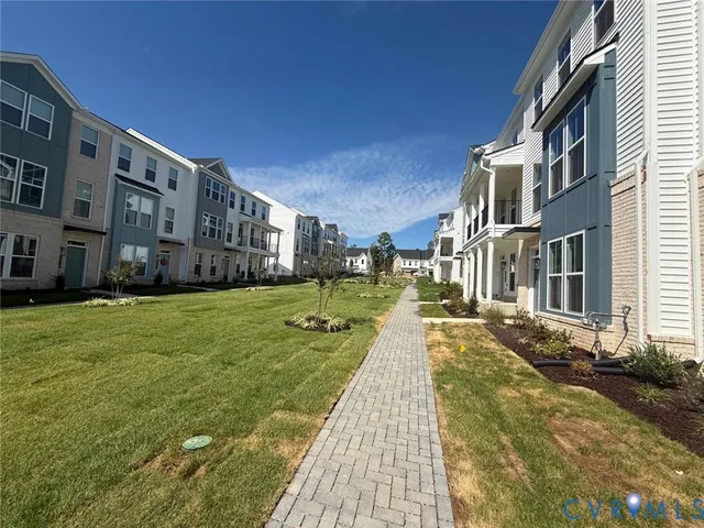 a view of a building with a yard