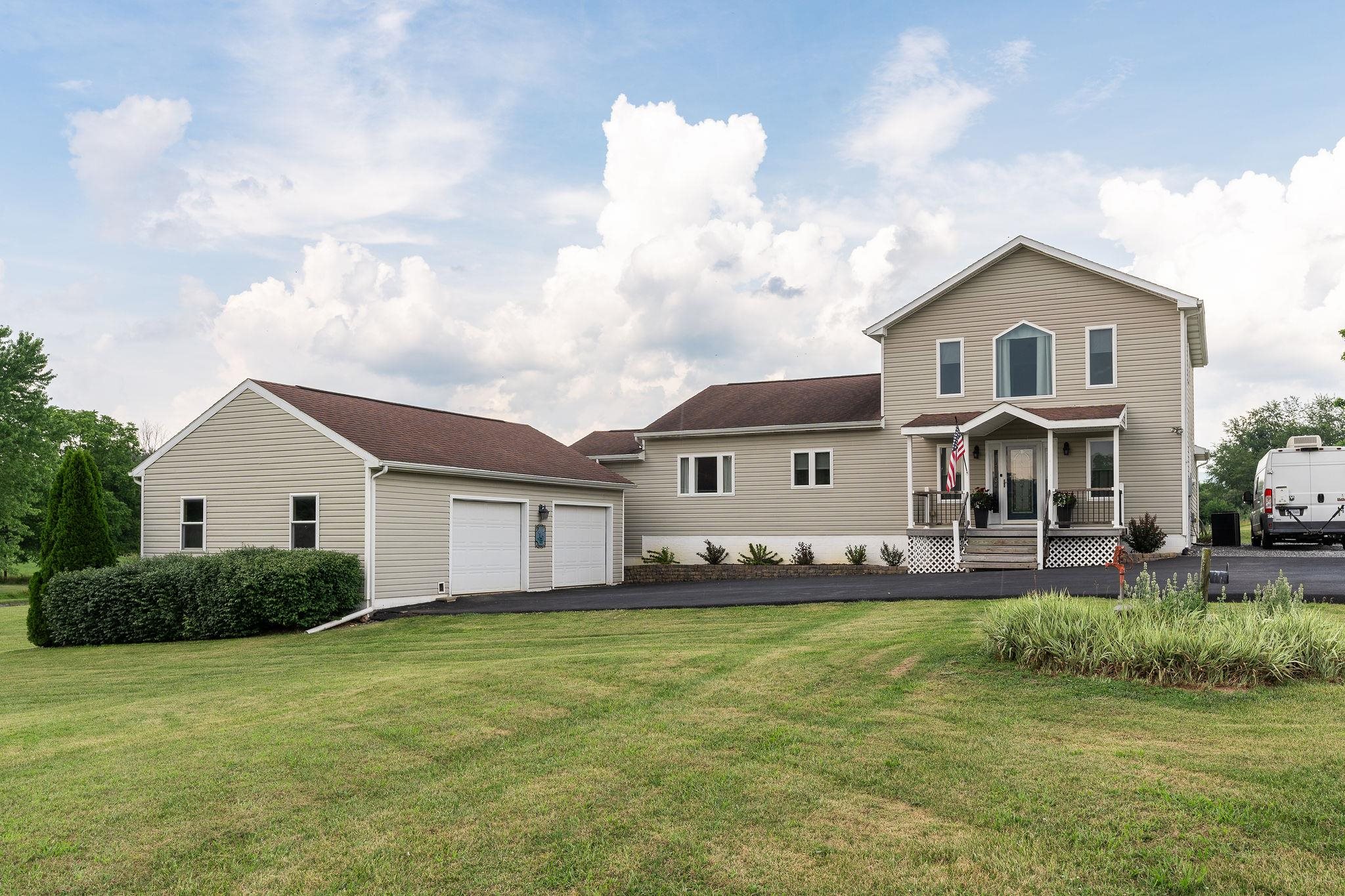 1373 Rockfish Road Waynesboro, VA 22980 - Photo 1 of 75 a front view of a house with a yard and garage