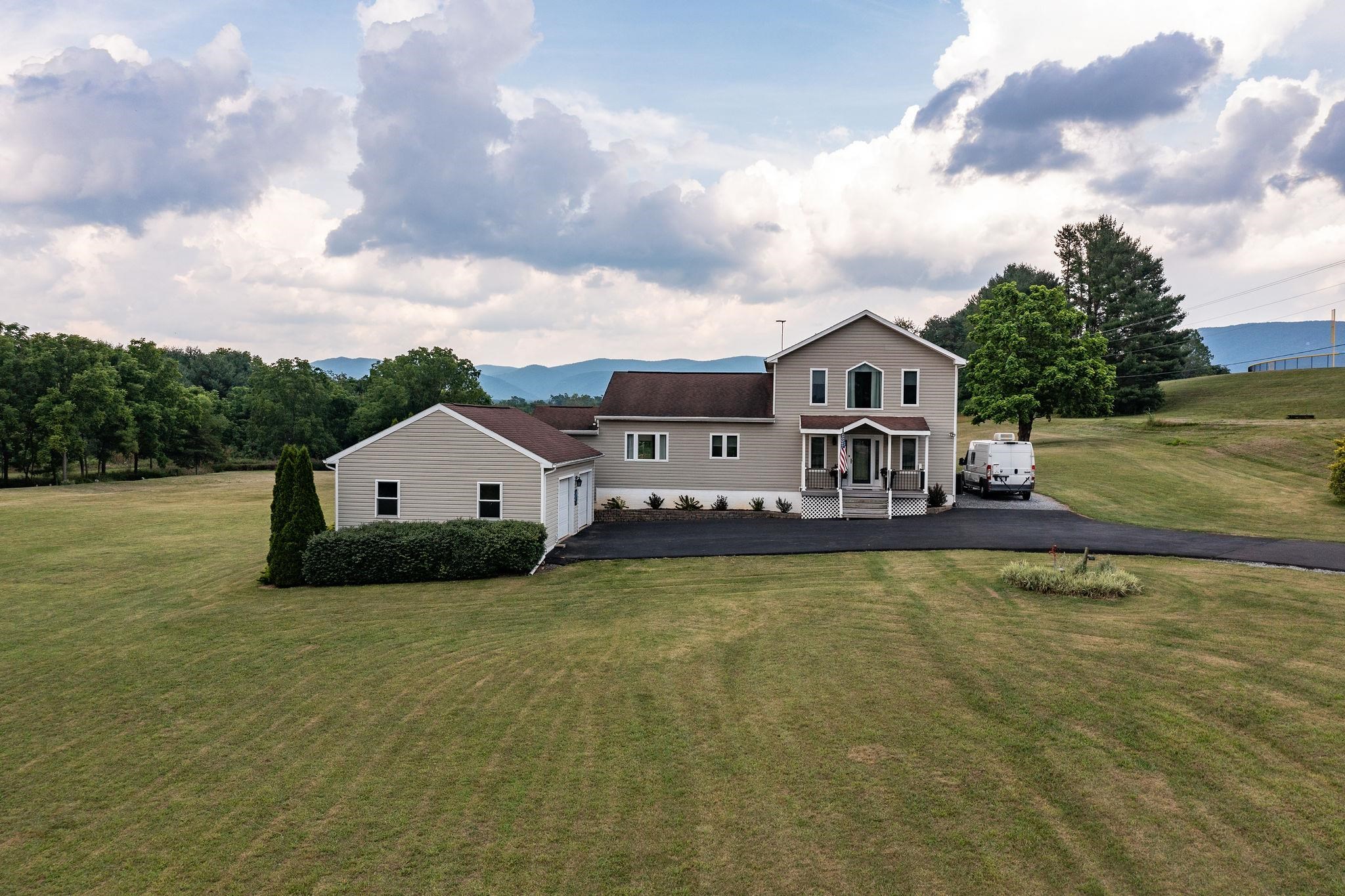 1373 Rockfish Road Waynesboro, VA 22980 - Photo 2 of 75 a view of a house with a big yard and a large tree
