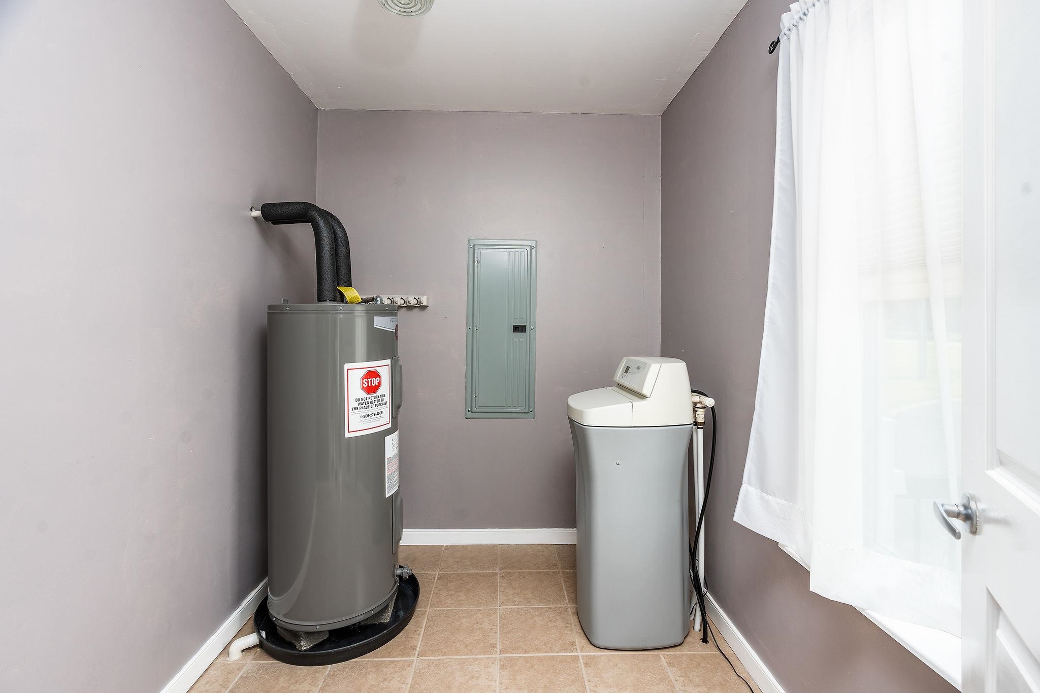 1373 Rockfish Road Waynesboro, VA 22980 - Photo 28 of 75 a utility room with water heater and racks