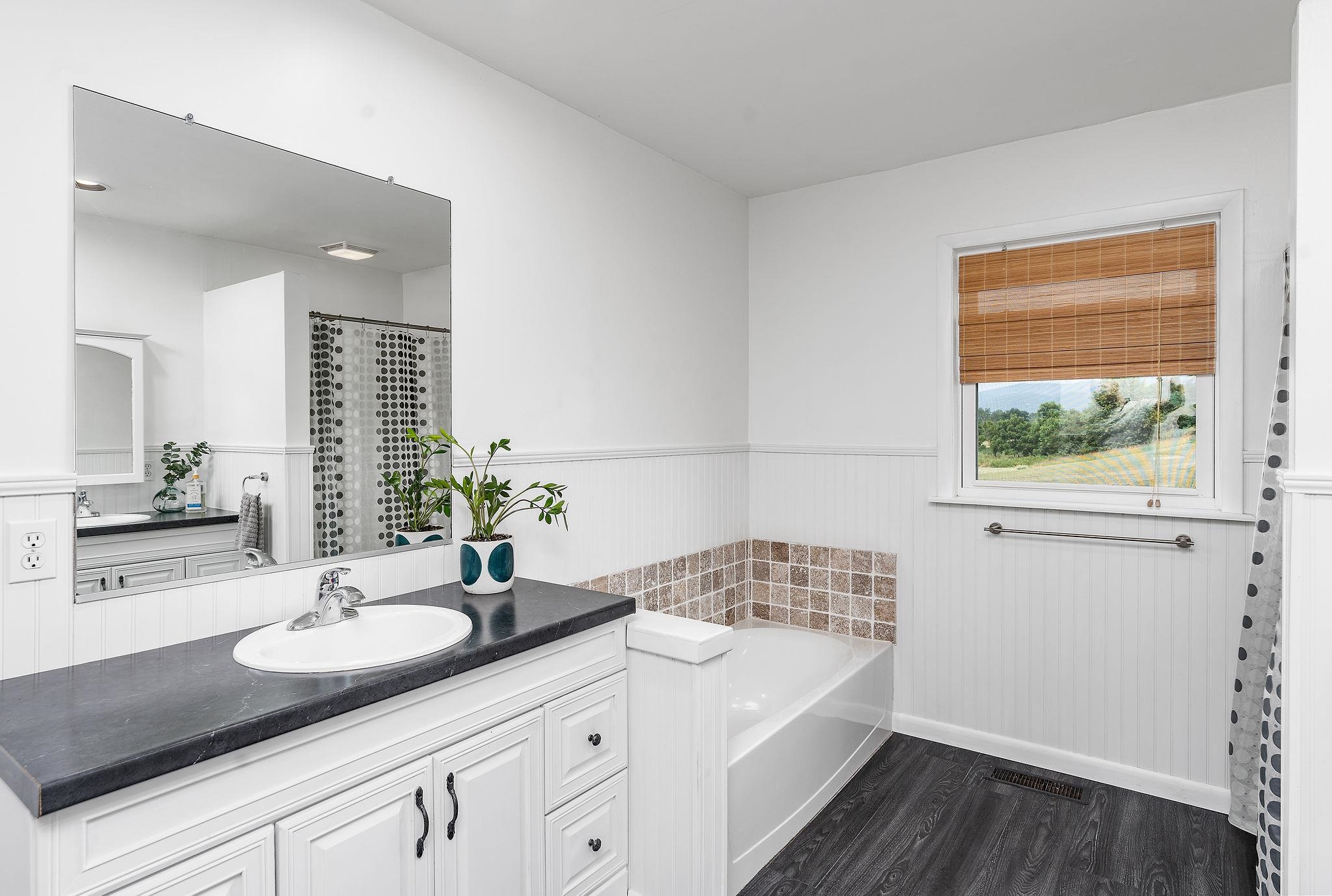 1373 Rockfish Road Waynesboro, VA 22980 - Photo 35 of 75 a bathroom with a sink double vanity granite and a mirror