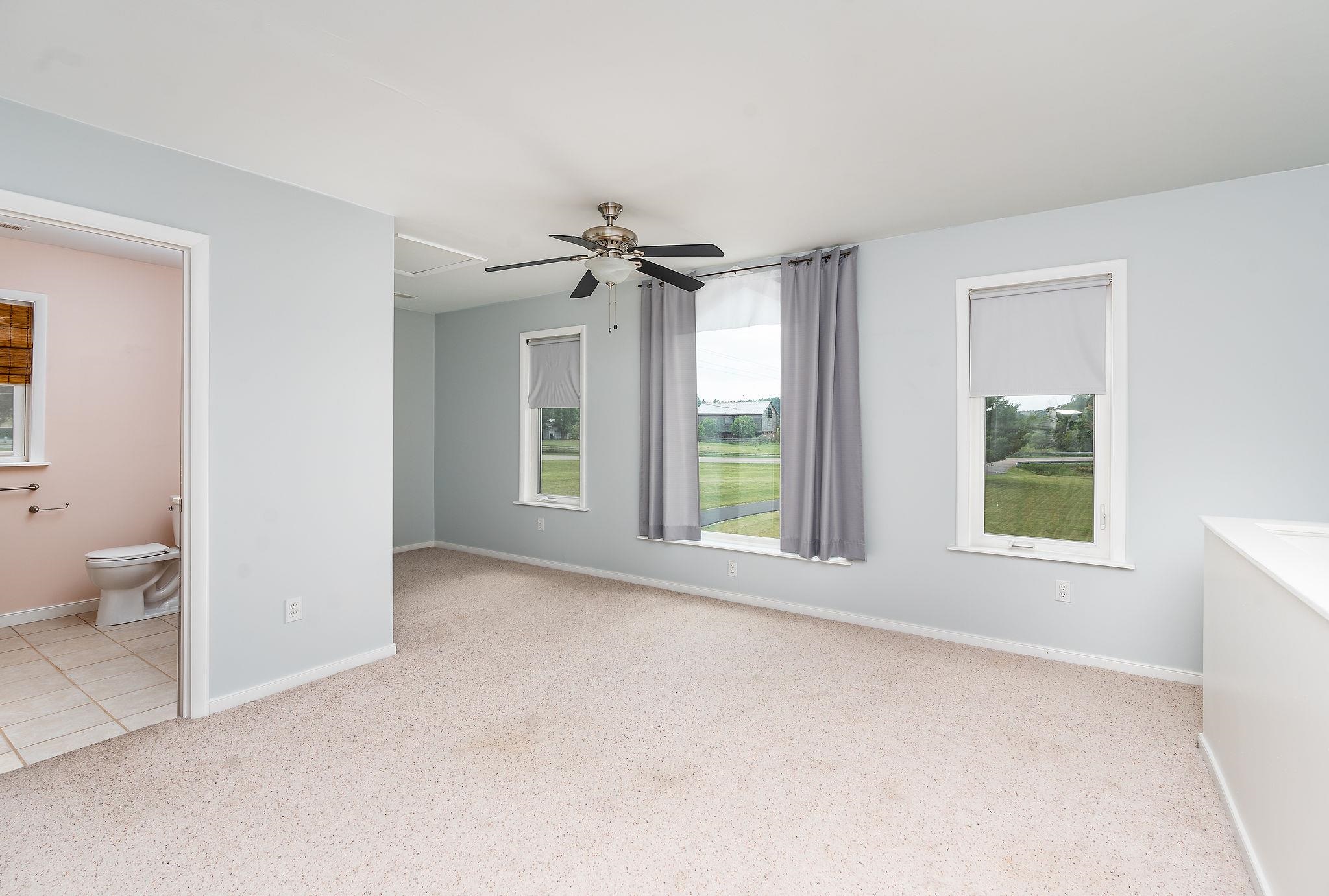 1373 Rockfish Road Waynesboro, VA 22980 - Photo 40 of 75 a view of a room with a windows and a ceiling fan