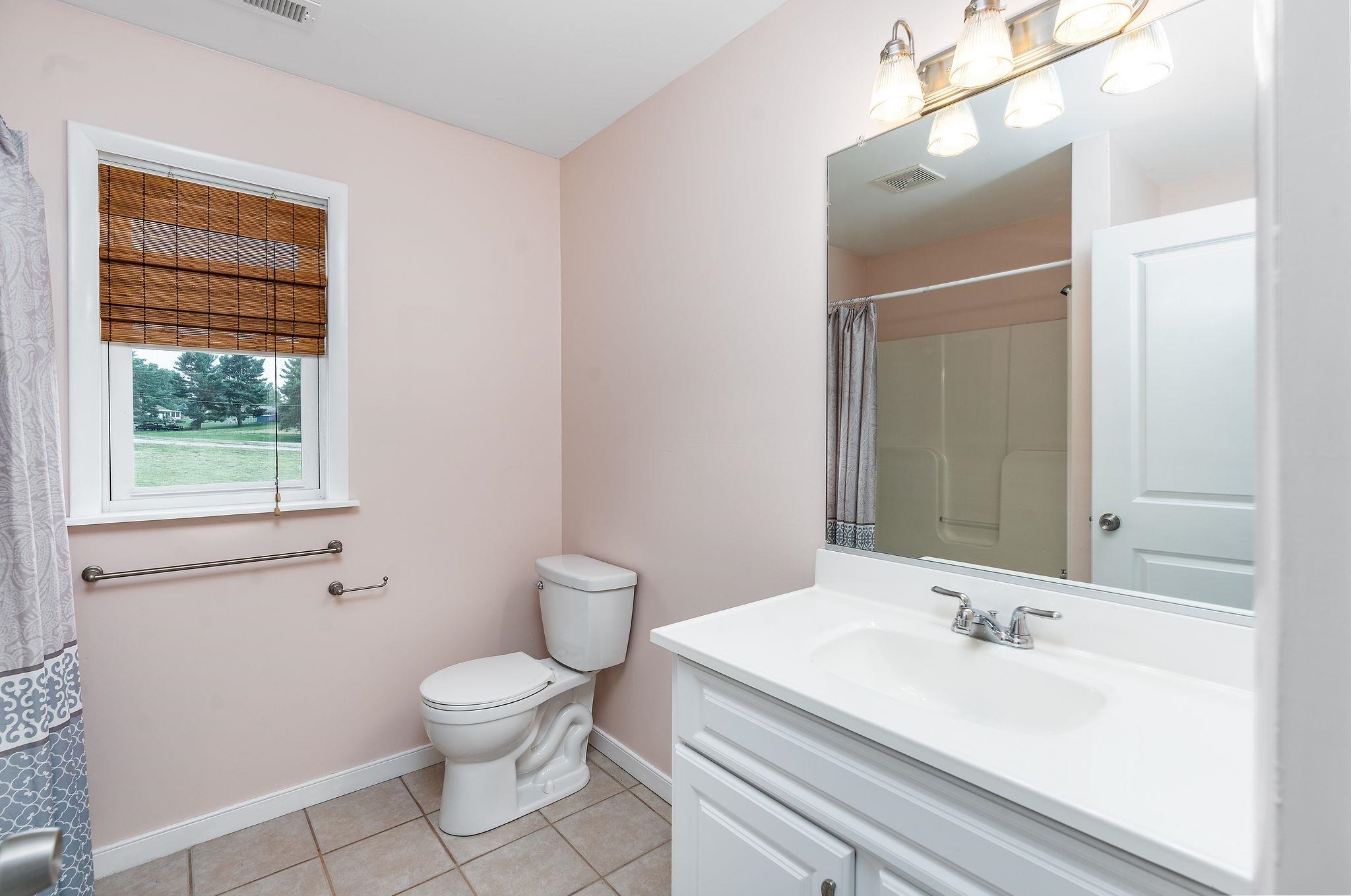 1373 Rockfish Road Waynesboro, VA 22980 - Photo 42 of 75 a bathroom with a sink a toilet and shower