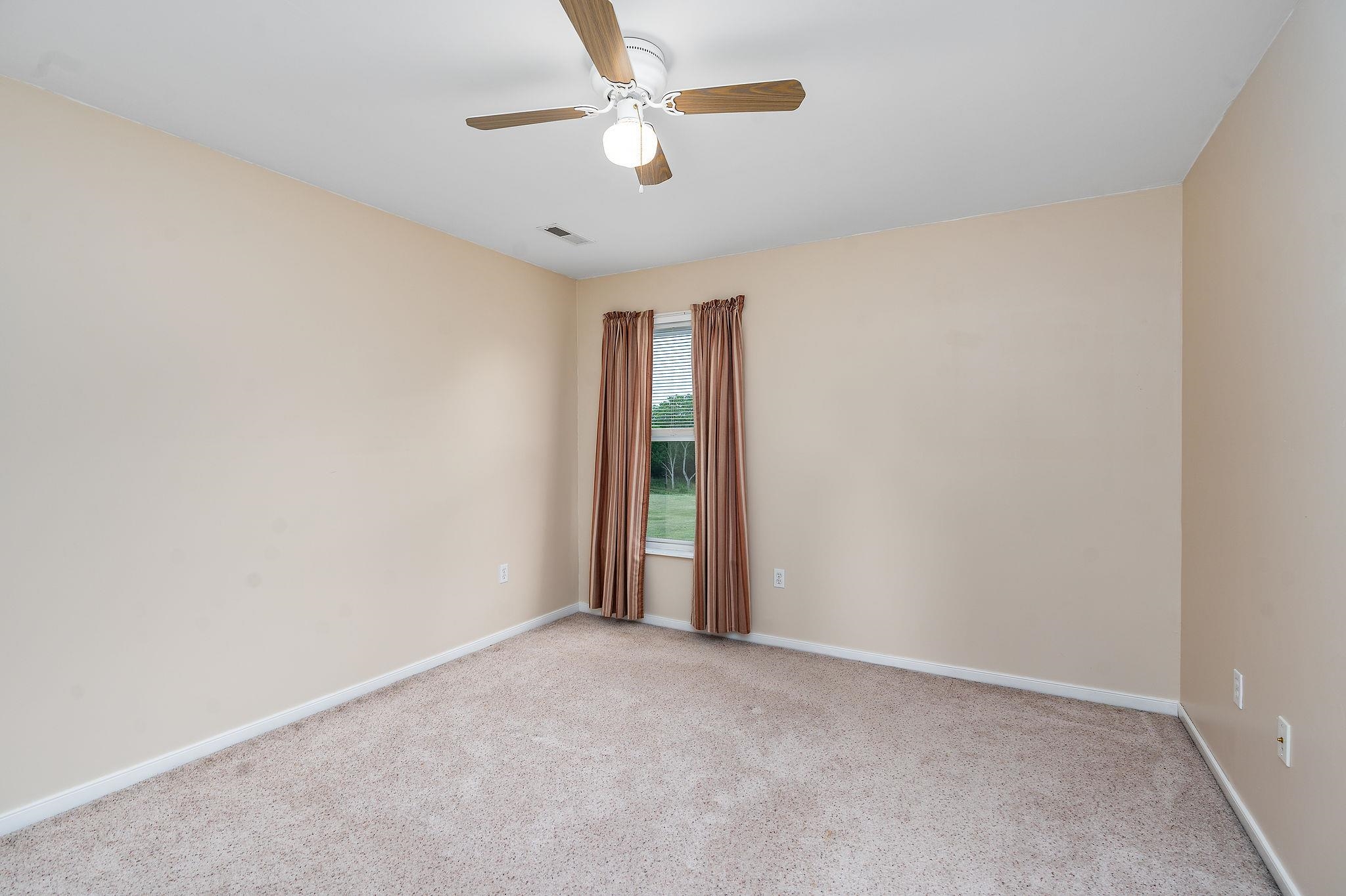 1373 Rockfish Road Waynesboro, VA 22980 - Photo 44 of 75 an empty room with an entryway and fan