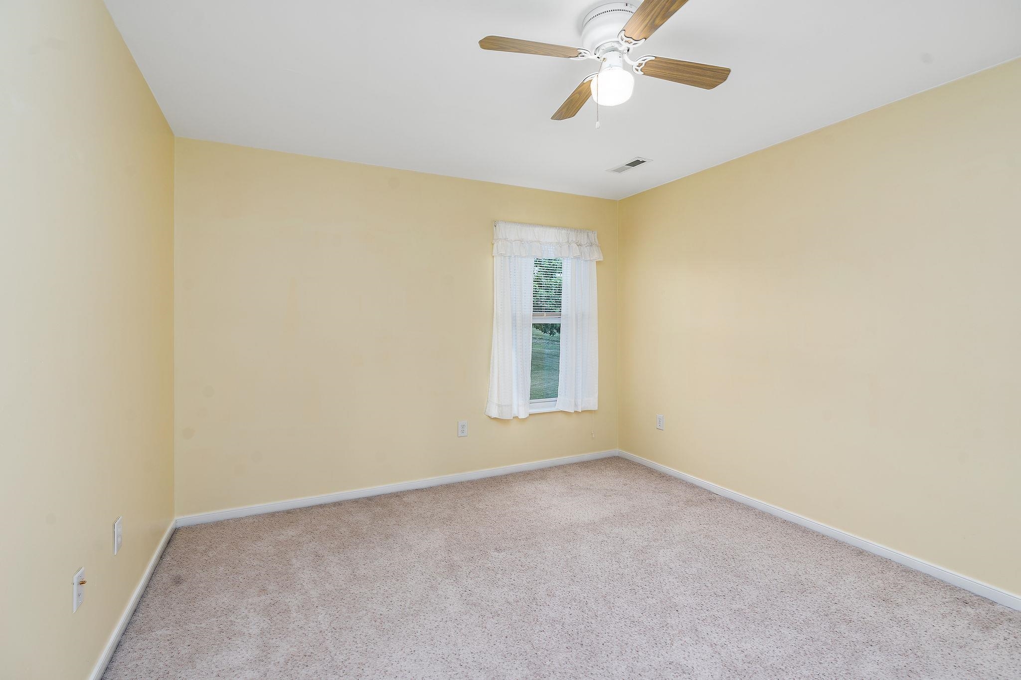 1373 Rockfish Road Waynesboro, VA 22980 - Photo 46 of 75 an empty room with a window and a fan