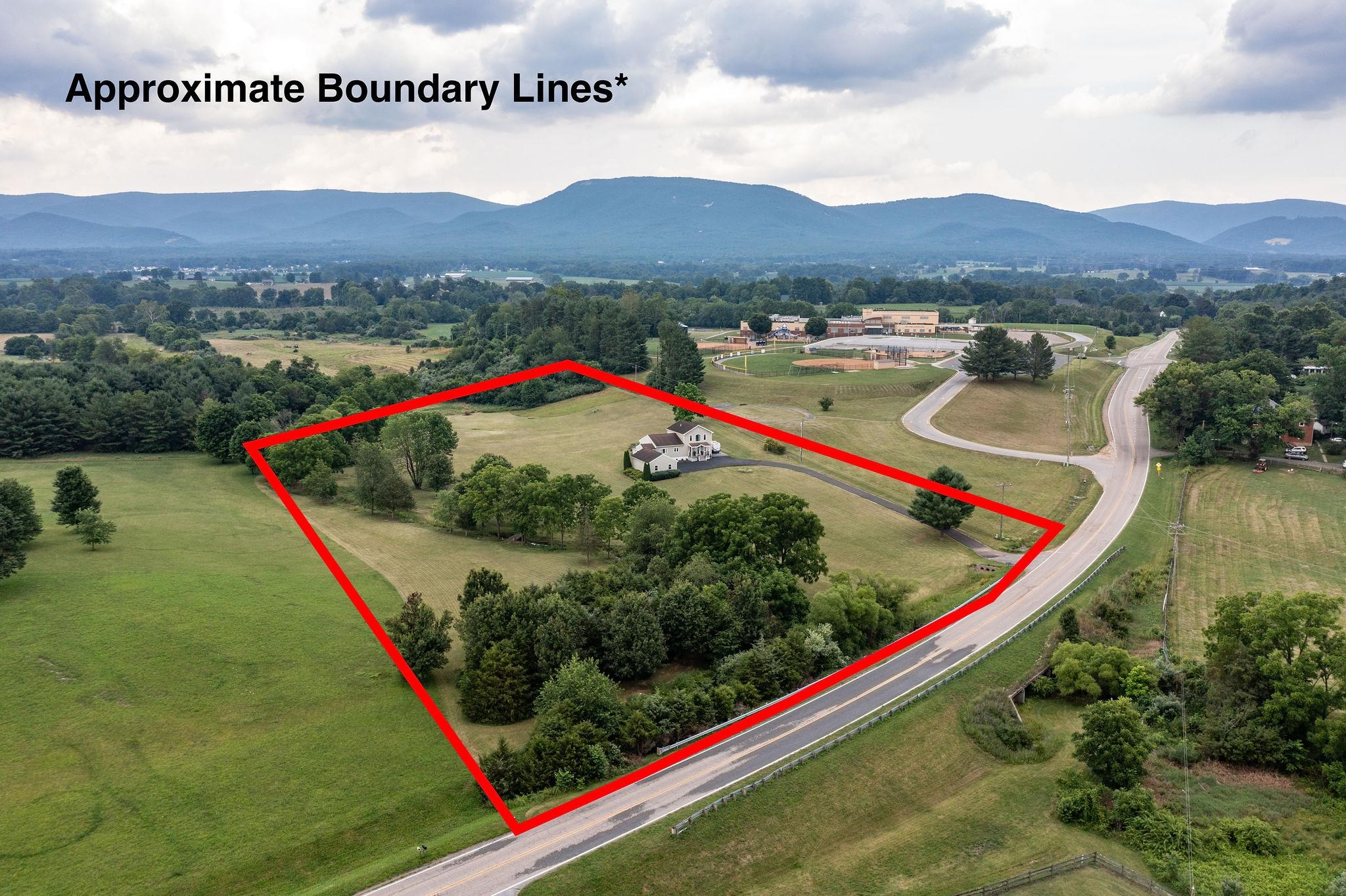 1373 Rockfish Road Waynesboro, VA 22980 - Photo 49 of 75 a view of a lush green hillside and a houses