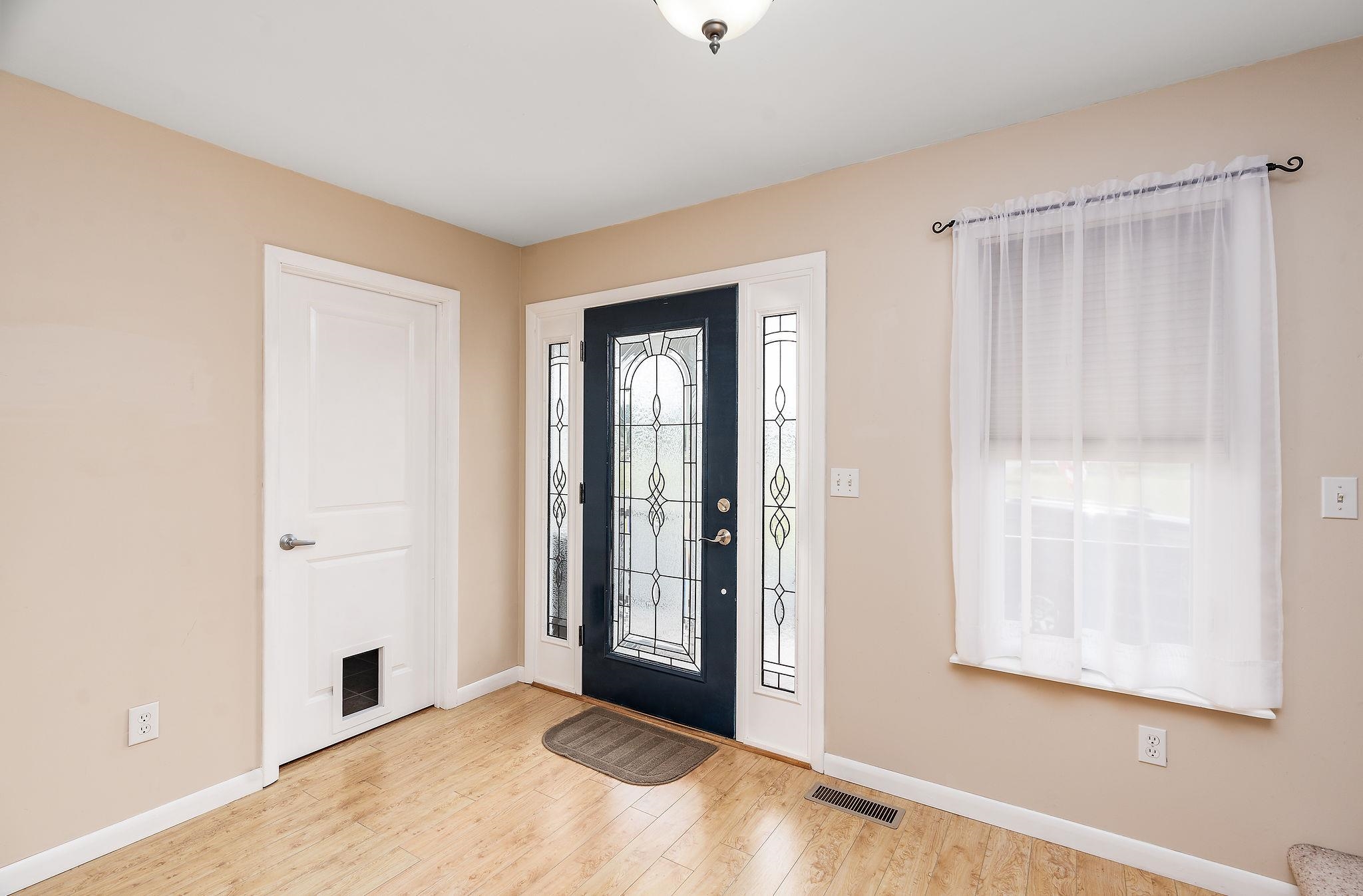 1373 Rockfish Road Waynesboro, VA 22980 - Photo 5 of 75 a view of an empty room with window and a bathroom