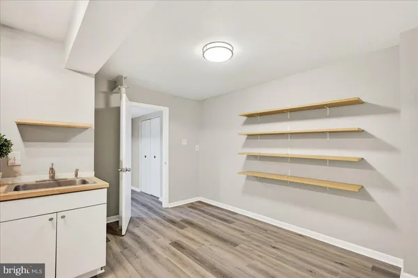 a kitchen with a sink and a refrigerator