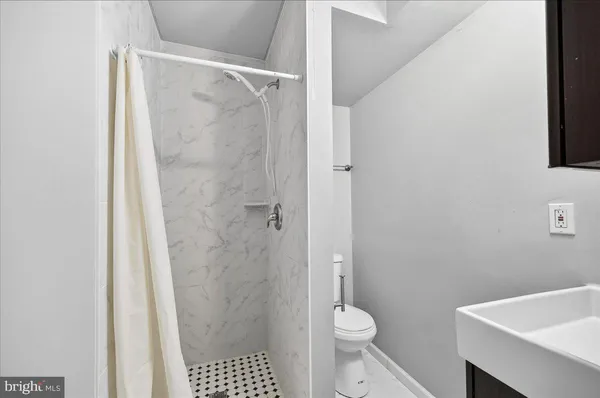 a bathroom with a sink and a toilet