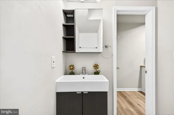 a bathroom with a sink and a mirror
