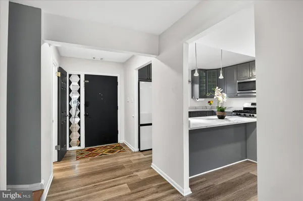 a view of a kitchen from the hallway