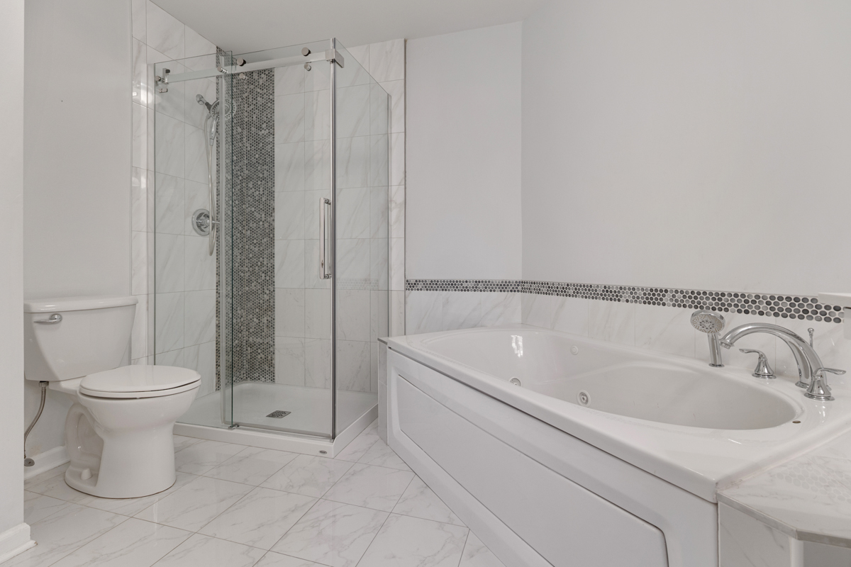 148 White Branch Court Buffalo Grove, IL 60089 - Photo 13 of 25 a bathroom with a sink toilet and shower