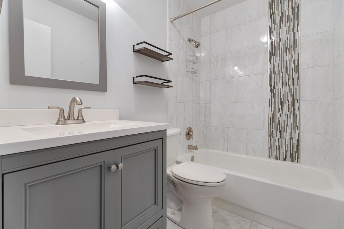 148 White Branch Court Buffalo Grove, IL 60089 - Photo 15 of 25 a bathroom with a sink a toilet and shower