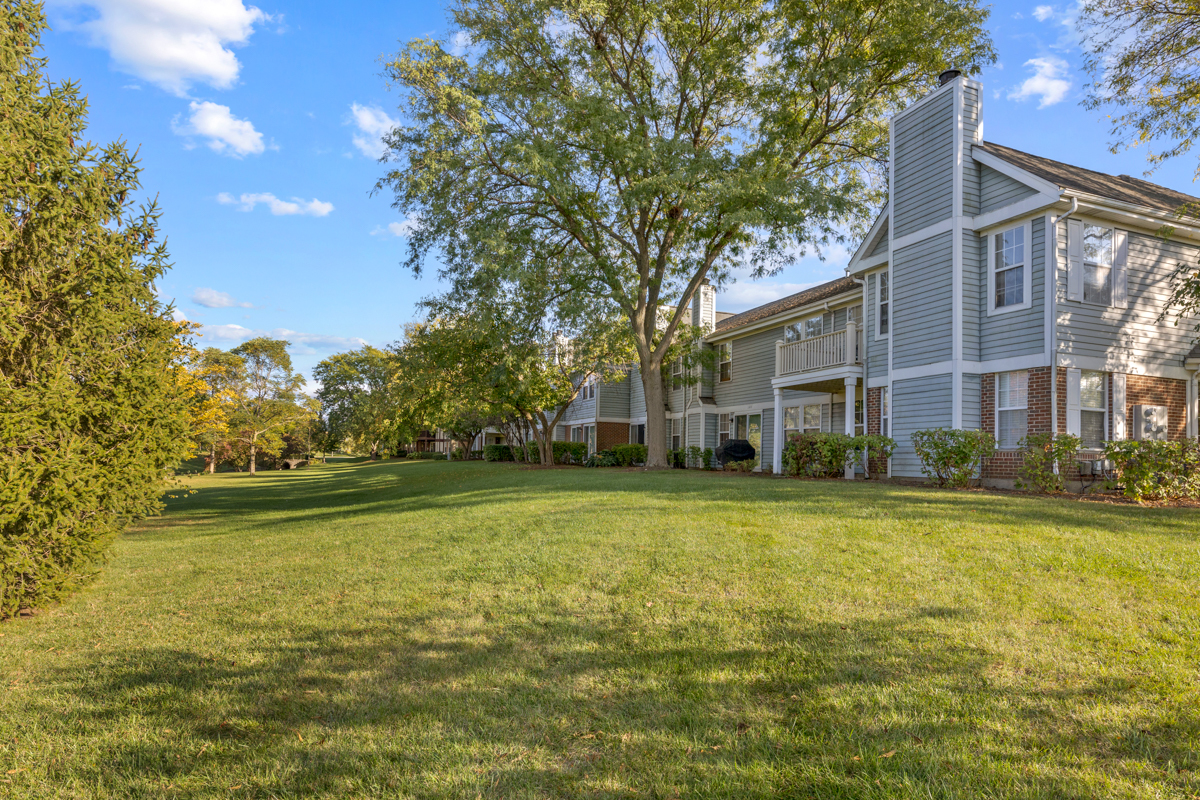 148 White Branch Court Buffalo Grove, IL 60089 - Photo 18 of 25 a front view of a house with a yard