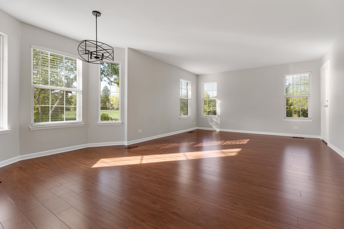 148 White Branch Court Buffalo Grove, IL 60089 - Photo 4 of 25 a view of wooden floor and windows in a room