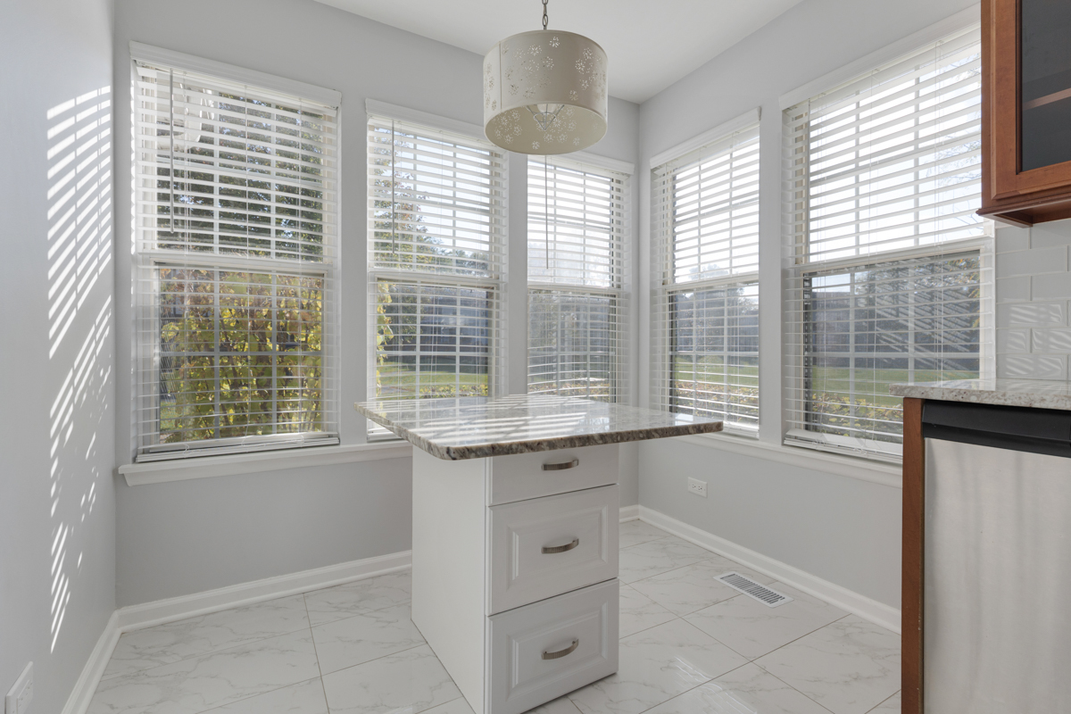 148 White Branch Court Buffalo Grove, IL 60089 - Photo 10 of 25 a view of granite countertop cabinets and window