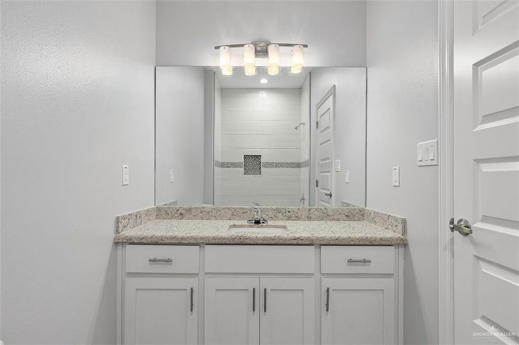 2109 Davenport Street, Unit 3 Weslaco, TX 78596 - Photo 14 of 15 a bathroom with a sink and a mirror
