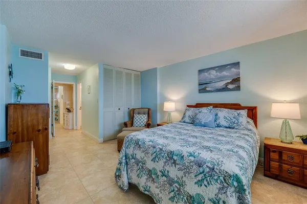 a bedroom with a bed and a view of bathroom