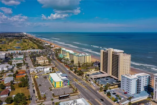 a view of city with ocean