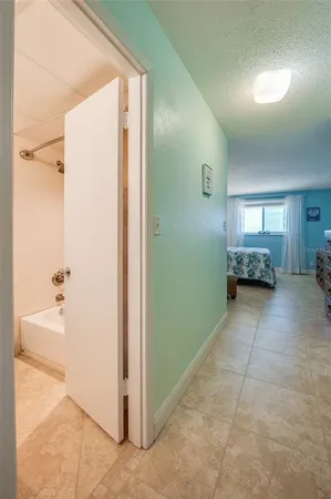 a view of hallway with livingroom and furniture