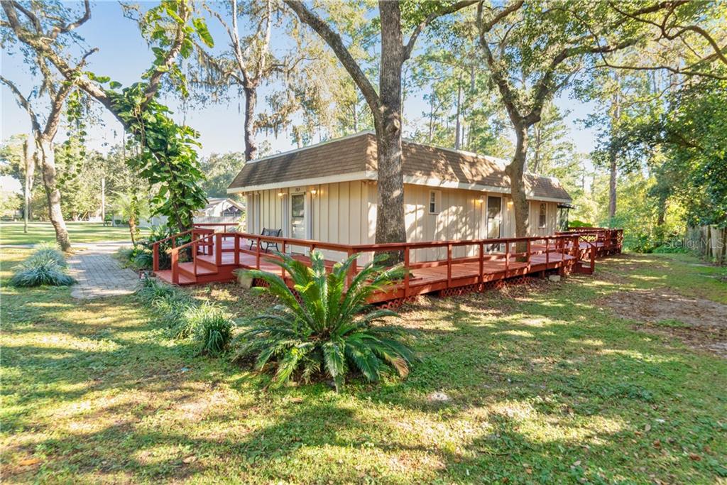 785 Longwood Markham Road Sanford, FL 32771 - Photo 1 of 1 a view of a yard with a table and chairs