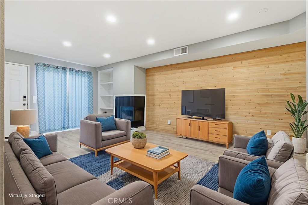 8594 Shramsburg Drive Rancho Cucamonga, CA 91730 - Photo 12 of 43 a living room with furniture and a flat screen tv