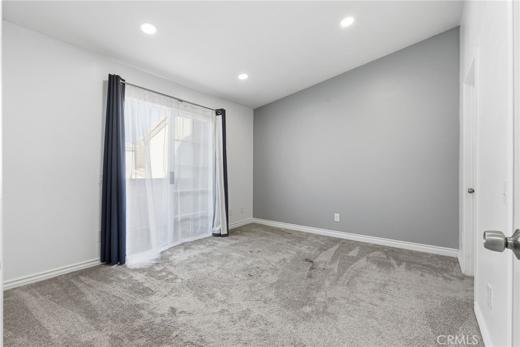 8594 Shramsburg Drive Rancho Cucamonga, CA 91730 - Photo 22 of 43 an empty room with windows