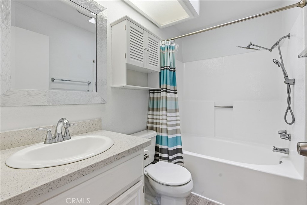 8594 Shramsburg Drive Rancho Cucamonga, CA 91730 - Photo 26 of 43 a bathroom with a sink toilet and shower