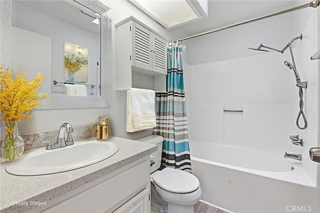 8594 Shramsburg Drive Rancho Cucamonga, CA 91730 - Photo 27 of 43 a bathroom with a sink toilet and shower