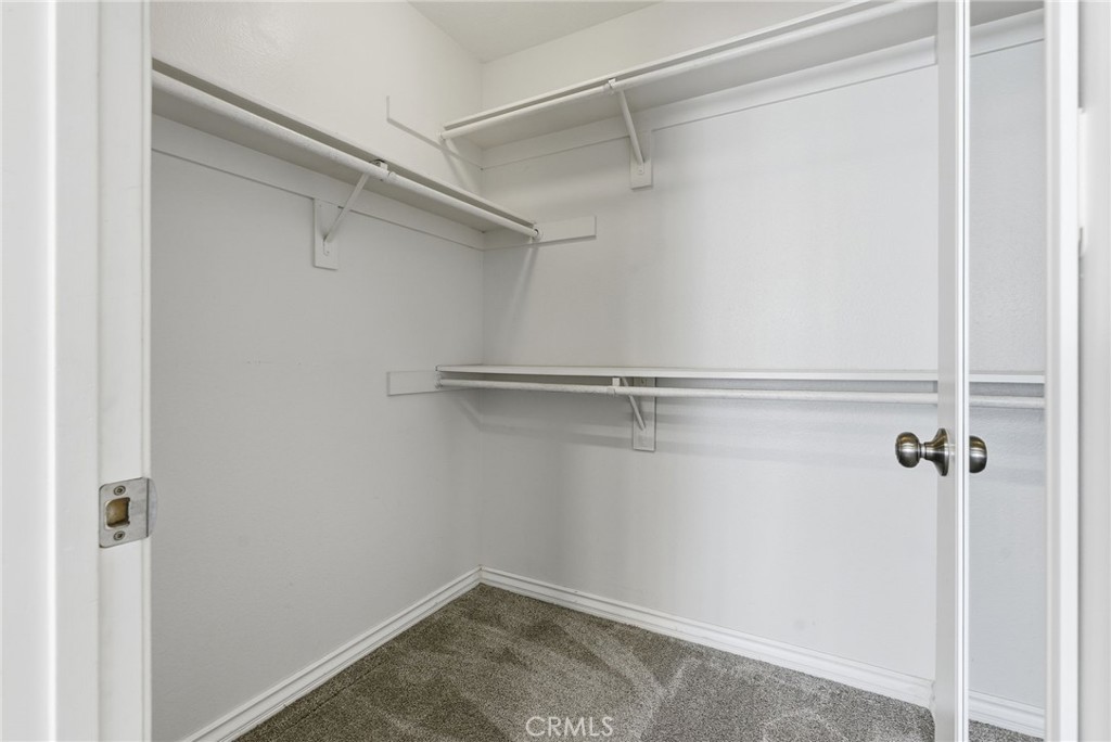 8594 Shramsburg Drive Rancho Cucamonga, CA 91730 - Photo 28 of 43 a view of a room with racks on the wall