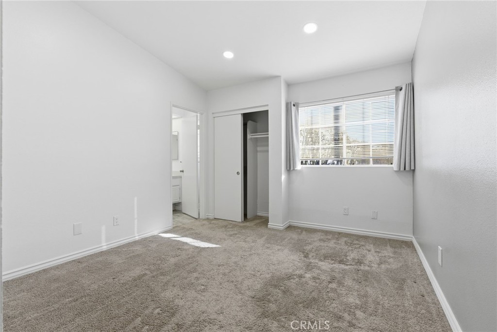 8594 Shramsburg Drive Rancho Cucamonga, CA 91730 - Photo 29 of 43 an empty room with windows