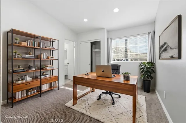 a workspace with furniture and window