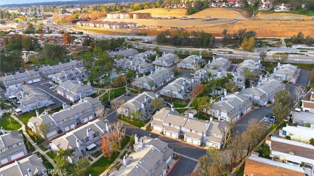 an aerial view of a house a yard and outdoor seating