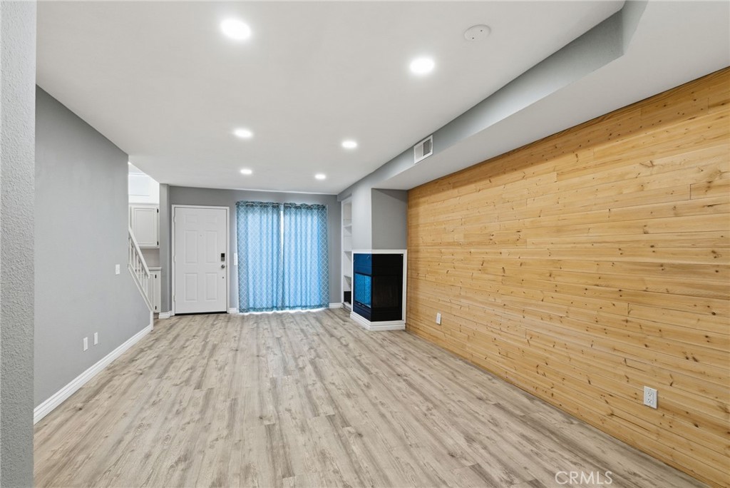 8594 Shramsburg Drive Rancho Cucamonga, CA 91730 - Photo 9 of 43 a view of empty room with wooden floor