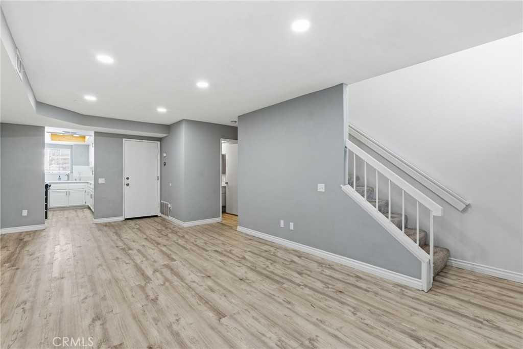8594 Shramsburg Drive Rancho Cucamonga, CA 91730 - Photo 10 of 43 a view of an empty room with wooden floor