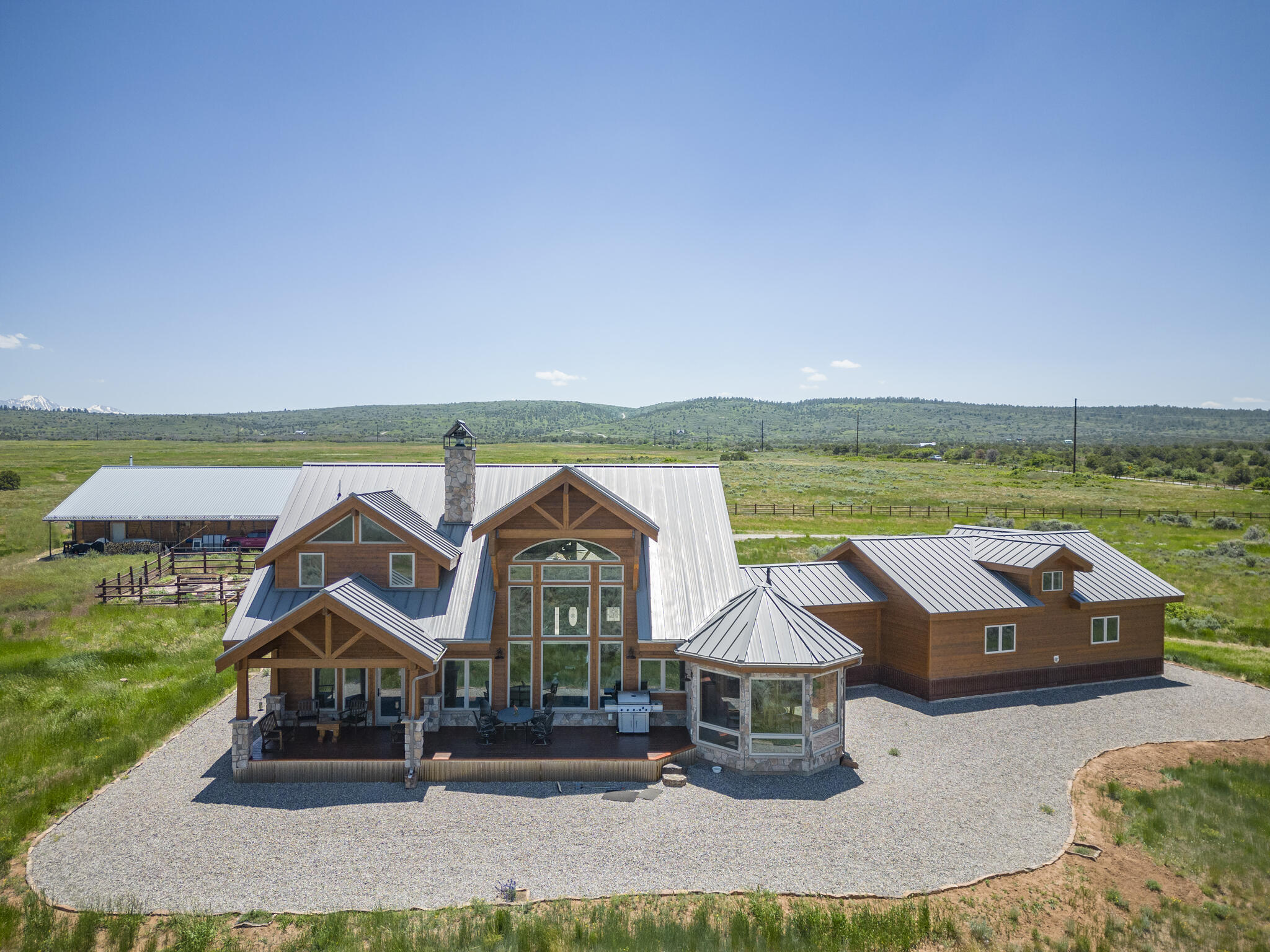 an aerial view of a house with a big yard