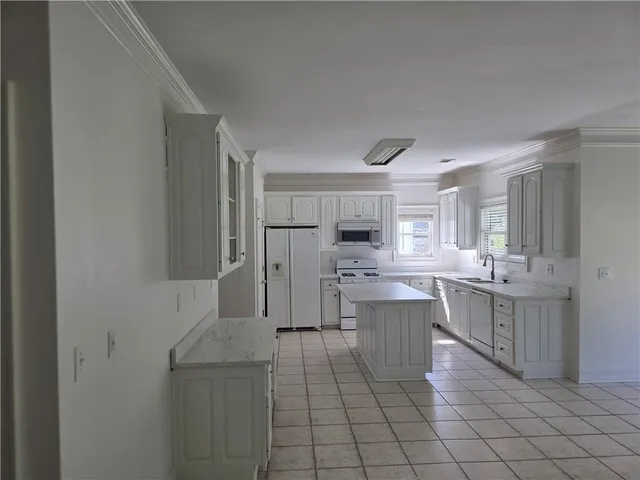 a kitchen with cabinets and counter top space