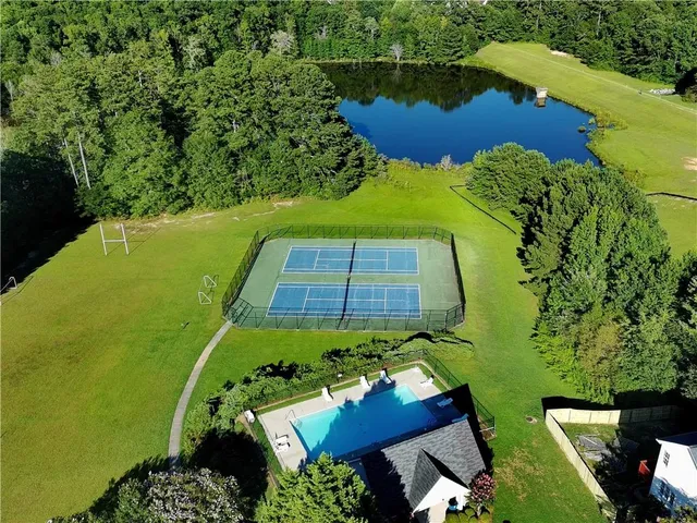 an aerial view of a pool yard swimming pool and outdoor seating