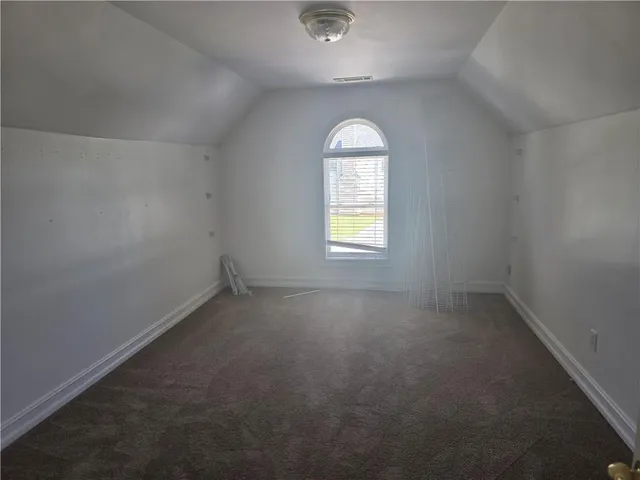 an empty room that has a window