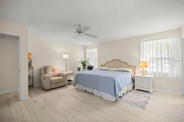 a spacious bedroom with a bed and a couch