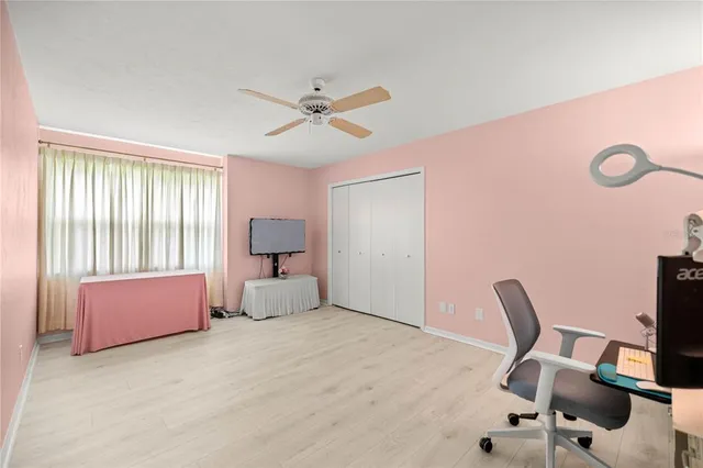 a bedroom with a bed and a chair