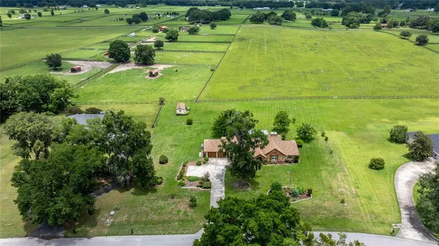 an aerial view of a houses with outdoor space and outdoor view