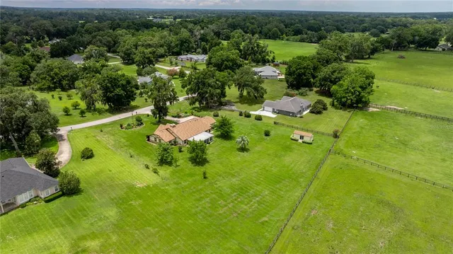 an aerial view of residential house with outdoor space