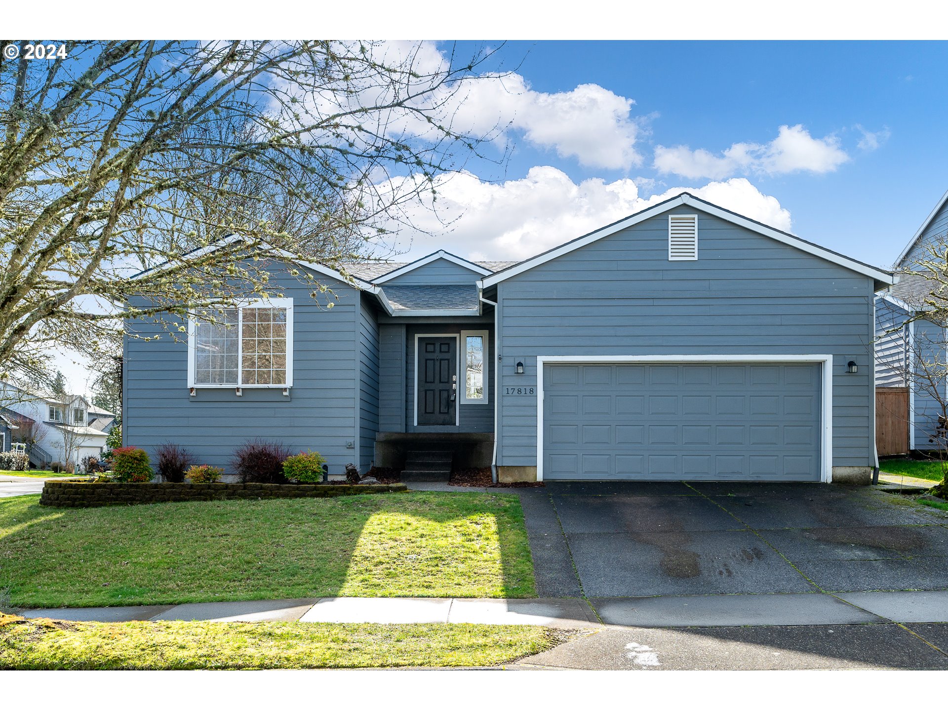 17818 Southwest Reisner Lane Sherwood, OR 97140 - Photo 1 of 20 a front view of a house with a yard