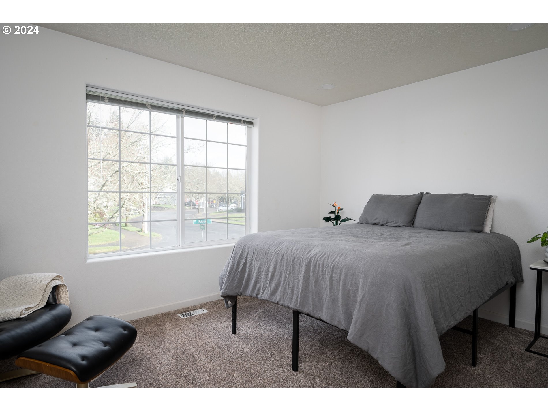 17818 Southwest Reisner Lane Sherwood, OR 97140 - Photo 14 of 20 a bedroom with a bed and a window