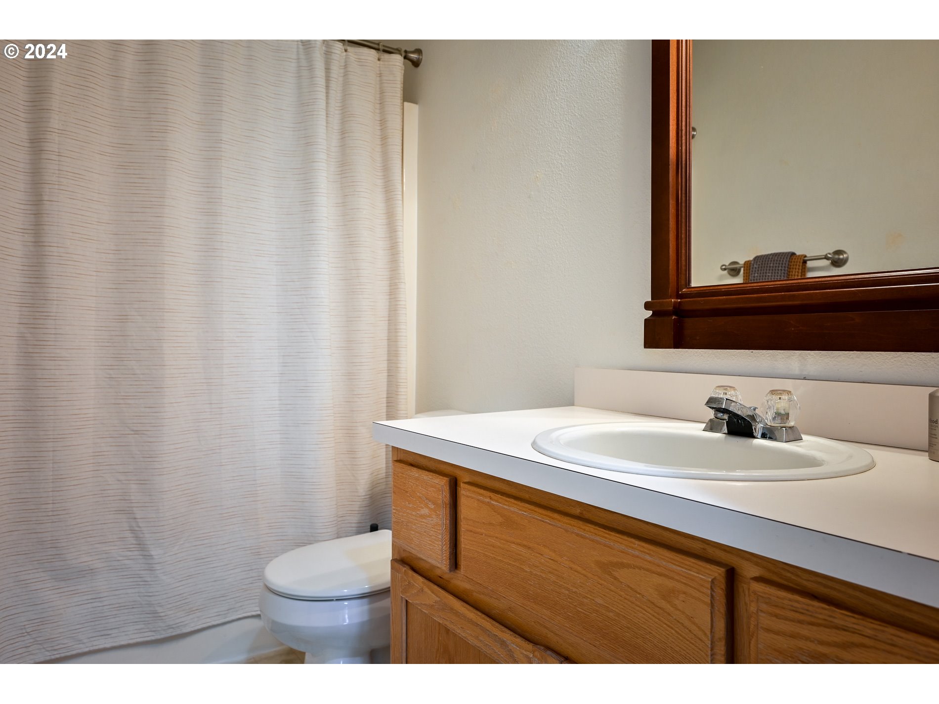17818 Southwest Reisner Lane Sherwood, OR 97140 - Photo 15 of 20 a bathroom with a sink and a mirror